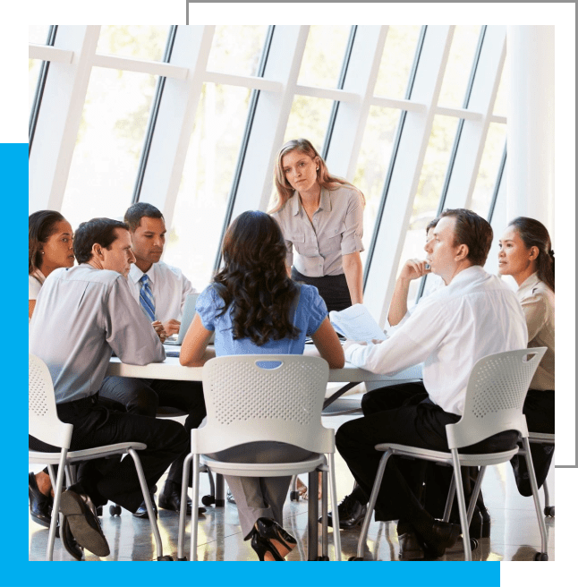 A group of people sitting around a table.